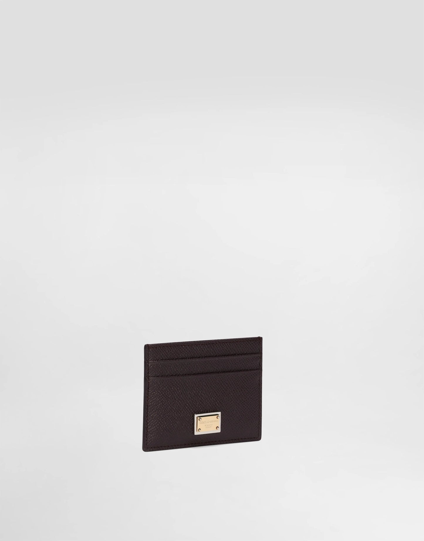 حامل بطاقات من جلد العجل مع لوحة تحمل العلامة التجارية